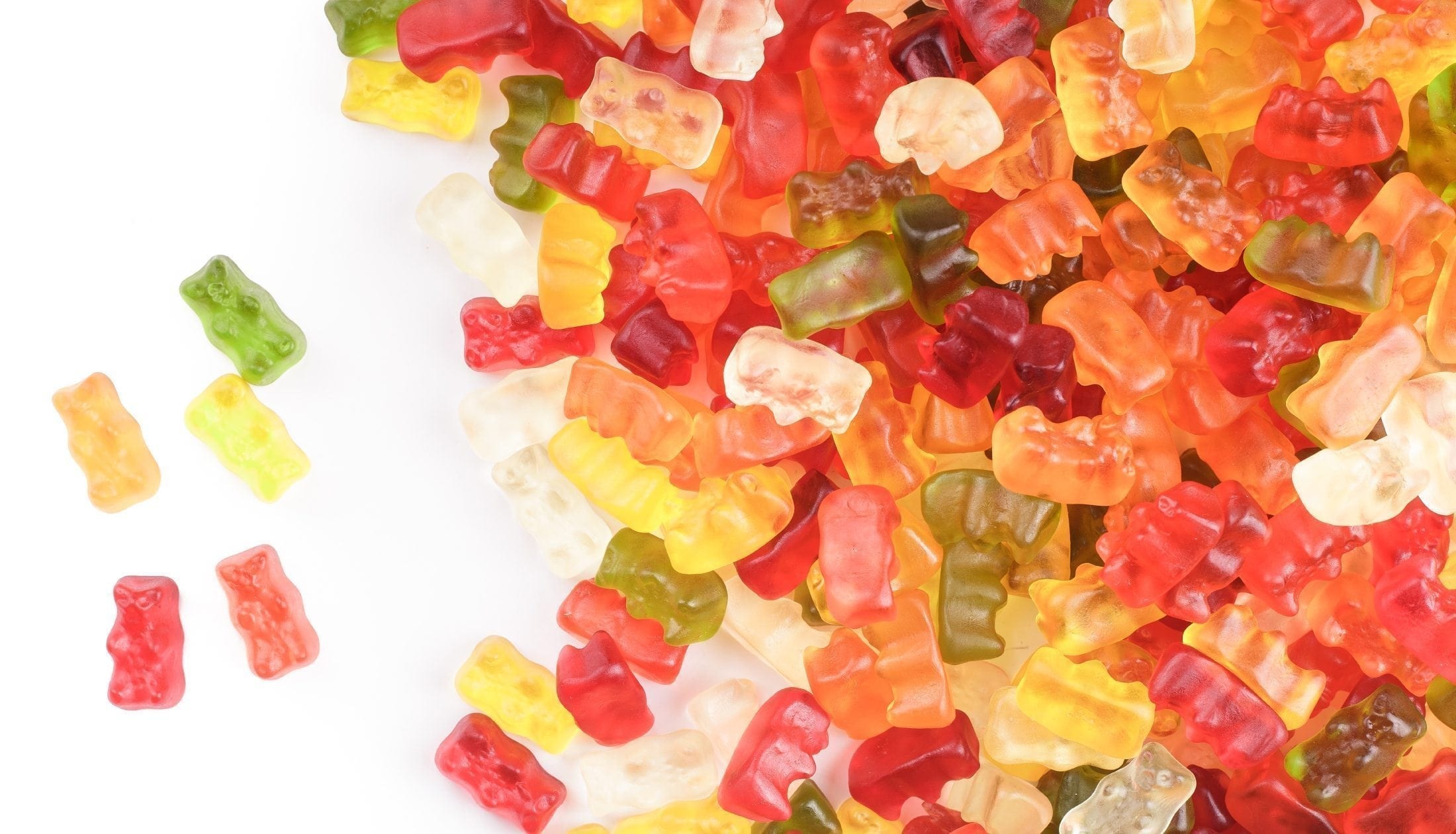 A pile of colorful gummy bears, showcasing a variety of flavors, related to sports nutrition supplements by SteelFit USA.