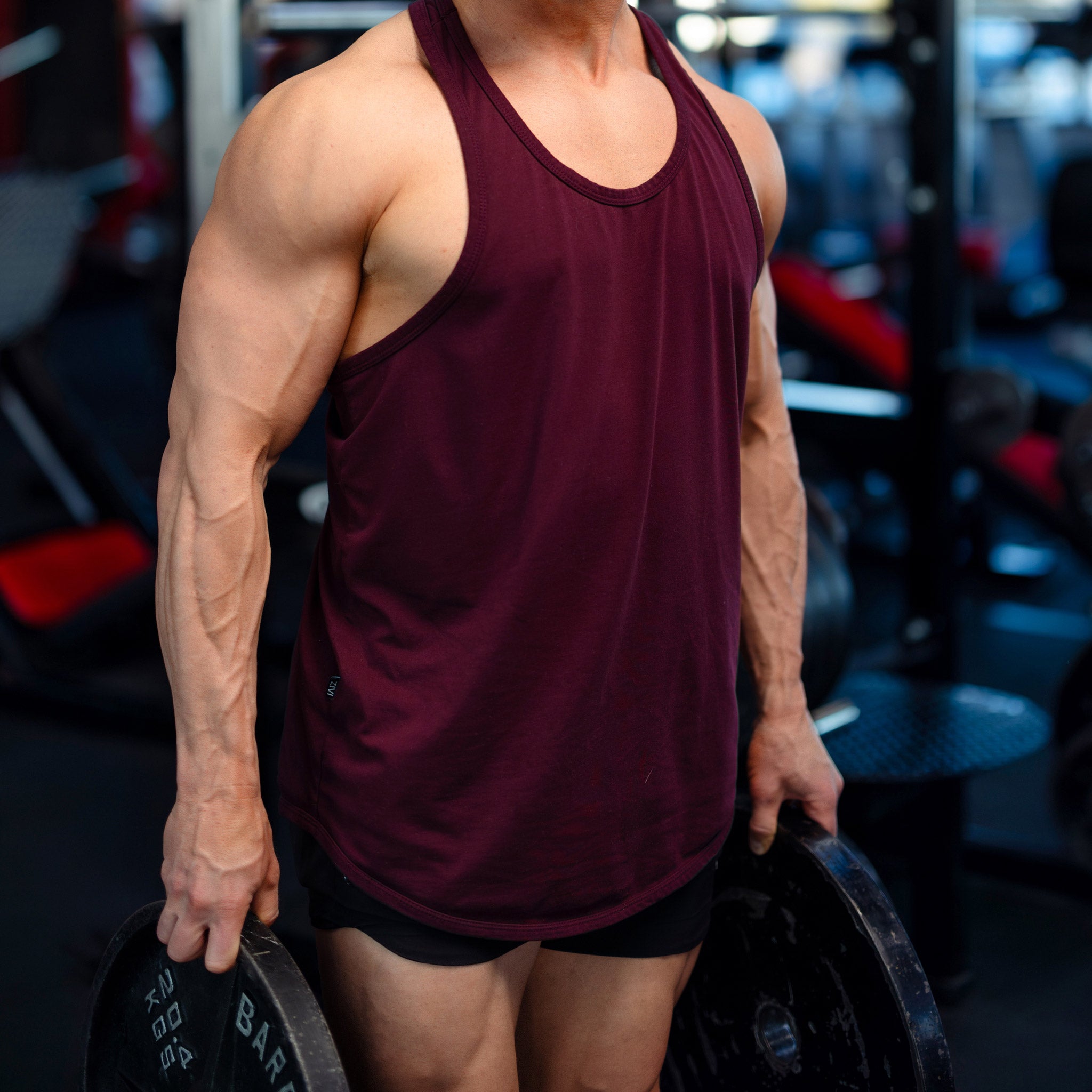 In shape male holding weights