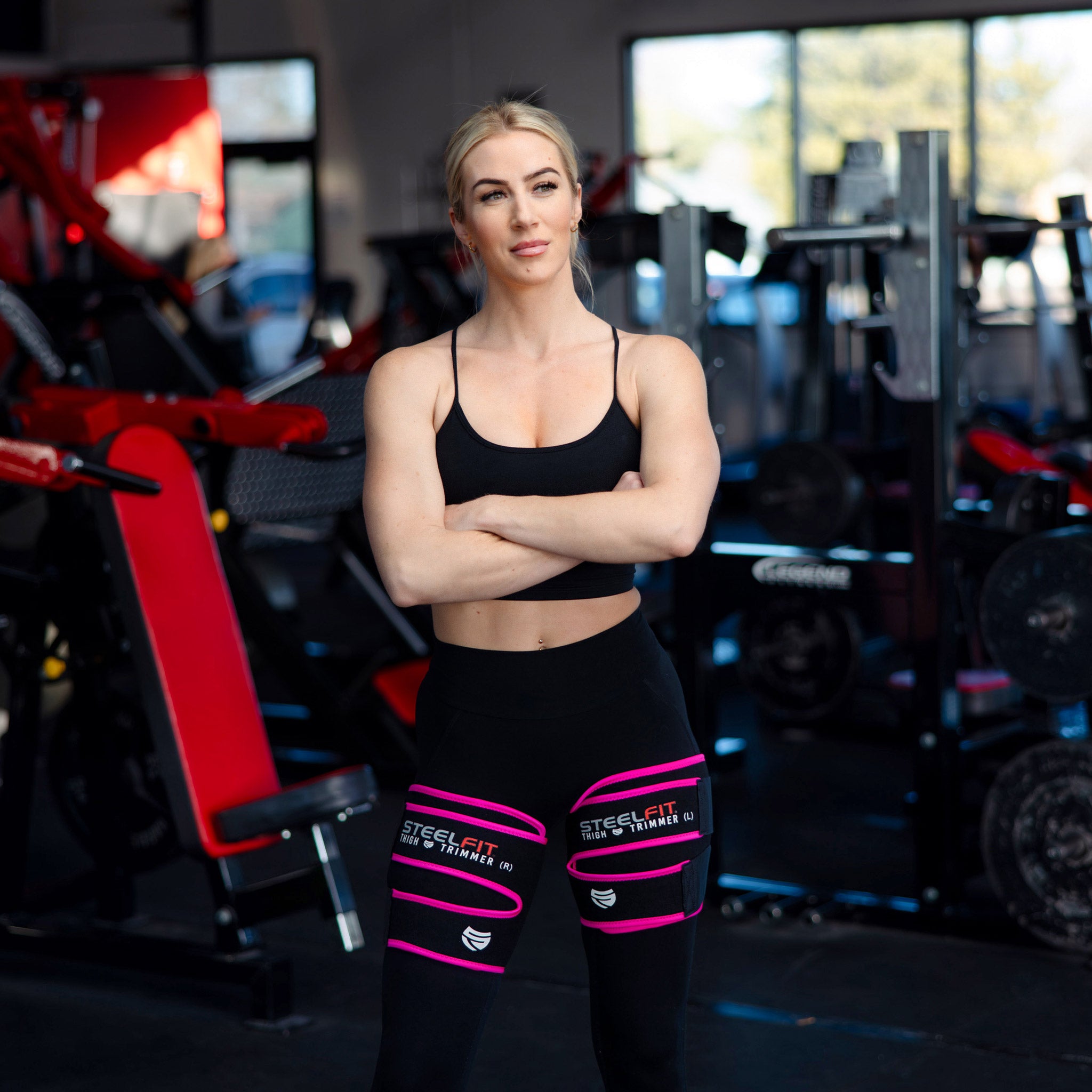 Fit woman with thigh trimmers on