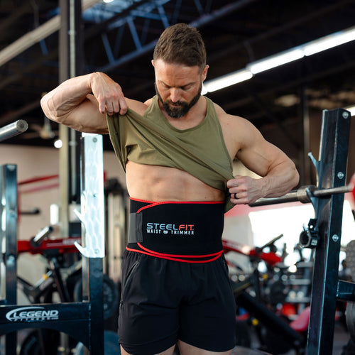 Adjustable Waist Trimmer worn by a man, showcasing its fit and flexibility. Promotes increased sweat and heat for enhanced fat burning during workouts.