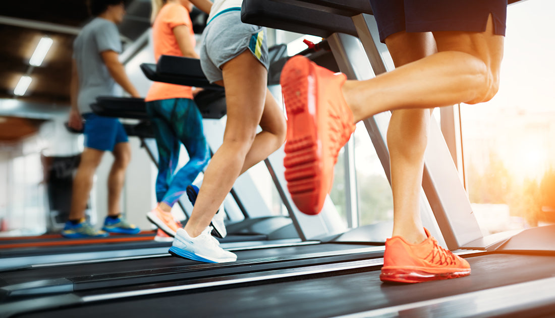 A group of people running on treadmills, highlighting exercise and fitness, relevant to SteelFit USA's health and fitness focus.