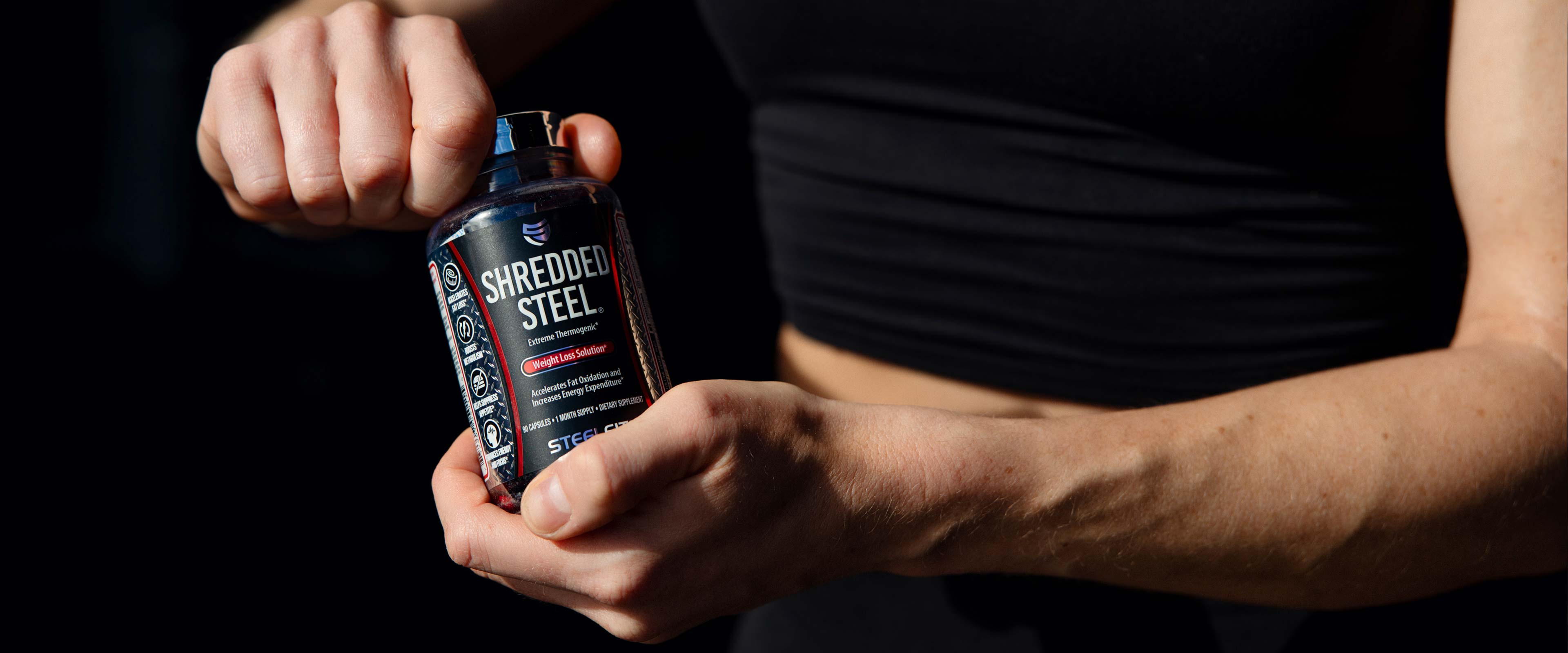 Person holding Shredded Steel Fat Burner from SteelFit