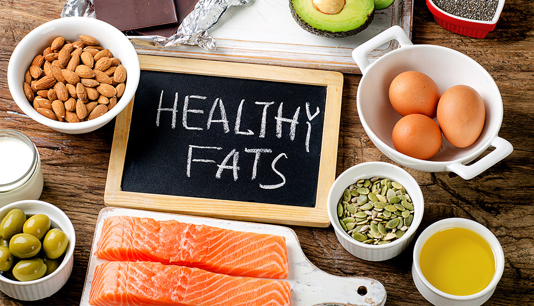 healthy fat foods such as eggs salmon avocado oil nuts chocolate