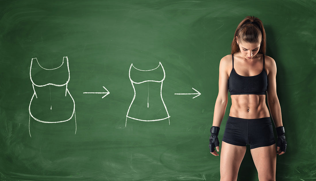 A woman in black sportswear and boxing gloves looks at a drawing of a woman's body, emphasizing fitness and body awareness.