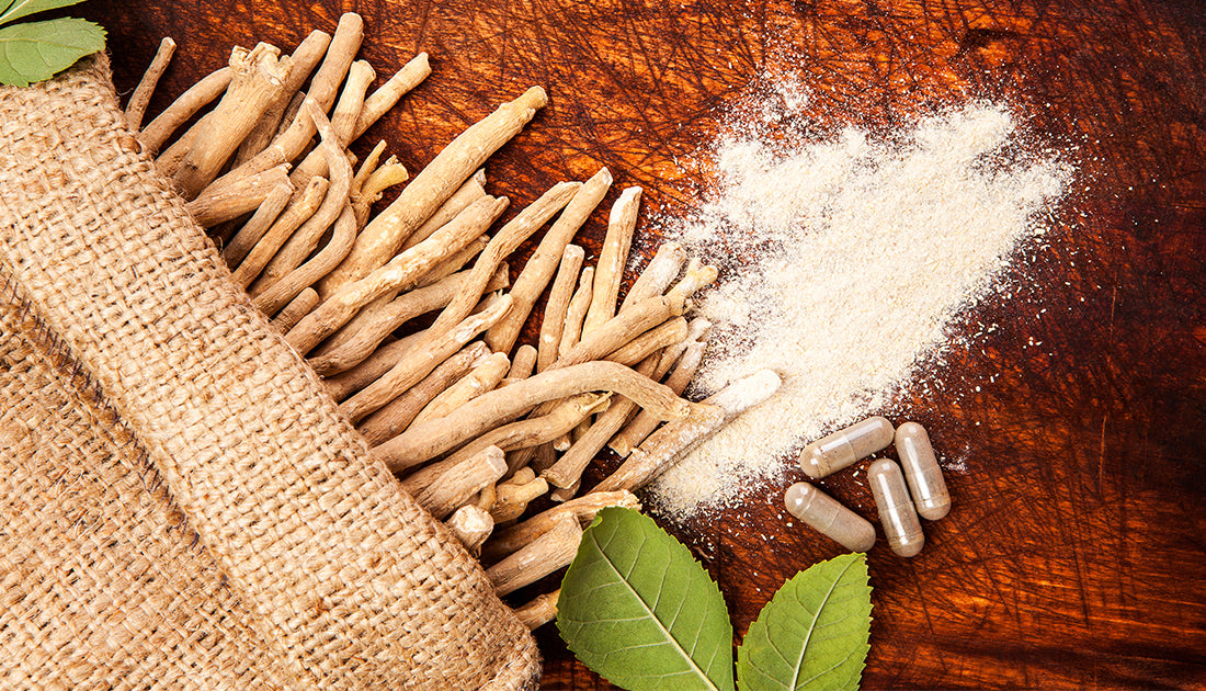 Burlap bag with roots, powder, and sticks alongside pills, suggesting natural ingredients for health and fitness supplements from SteelFit USA.