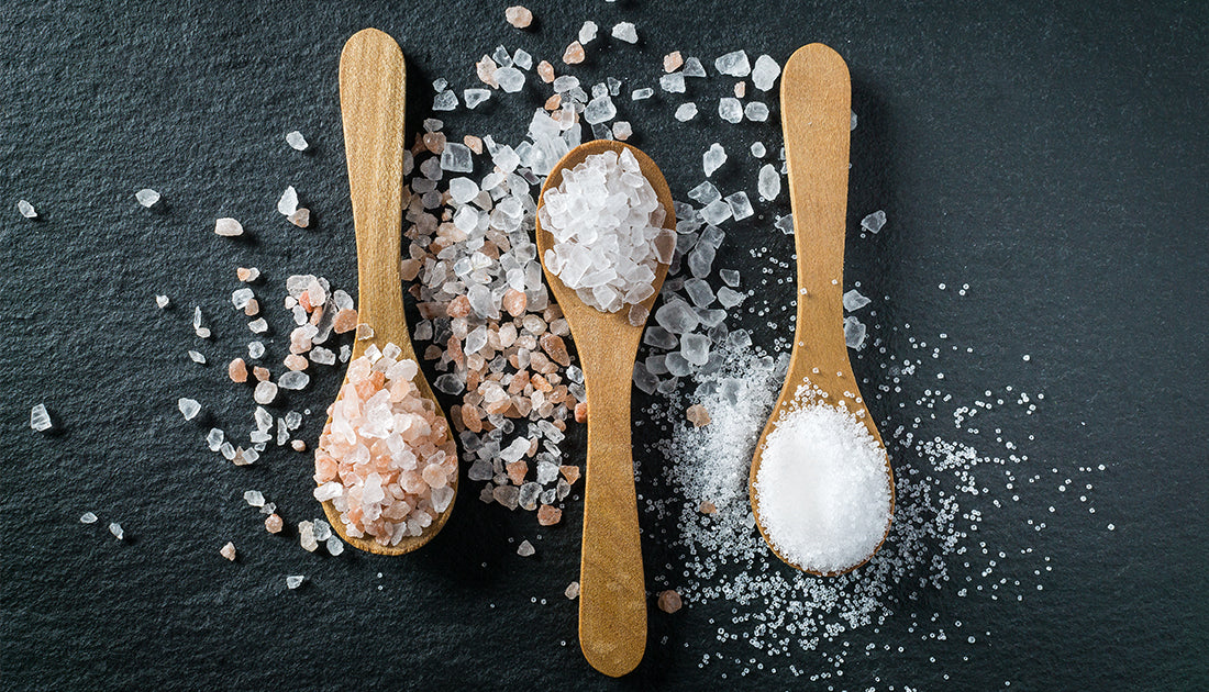 3 wooden spoons with sea salt and himalayan salt