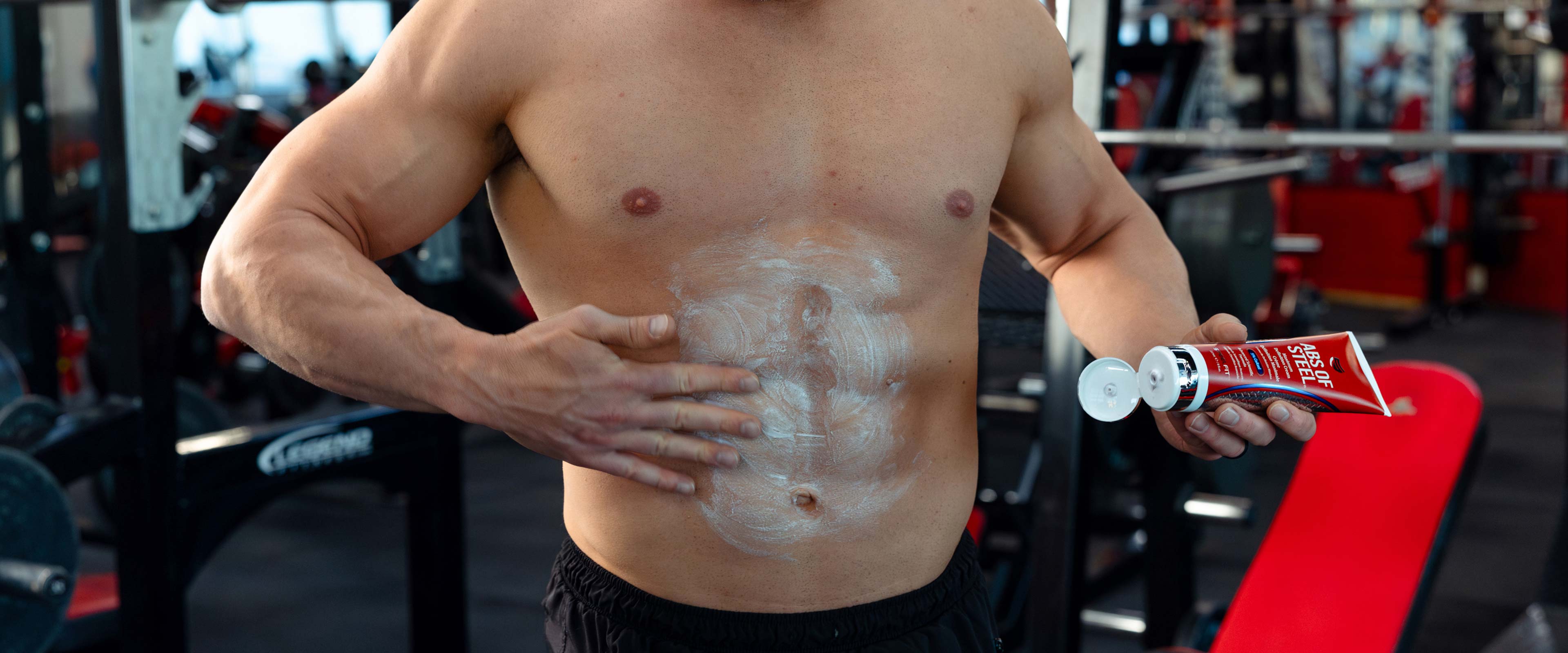 Man rubbing on Abs of Steel fat burning cream