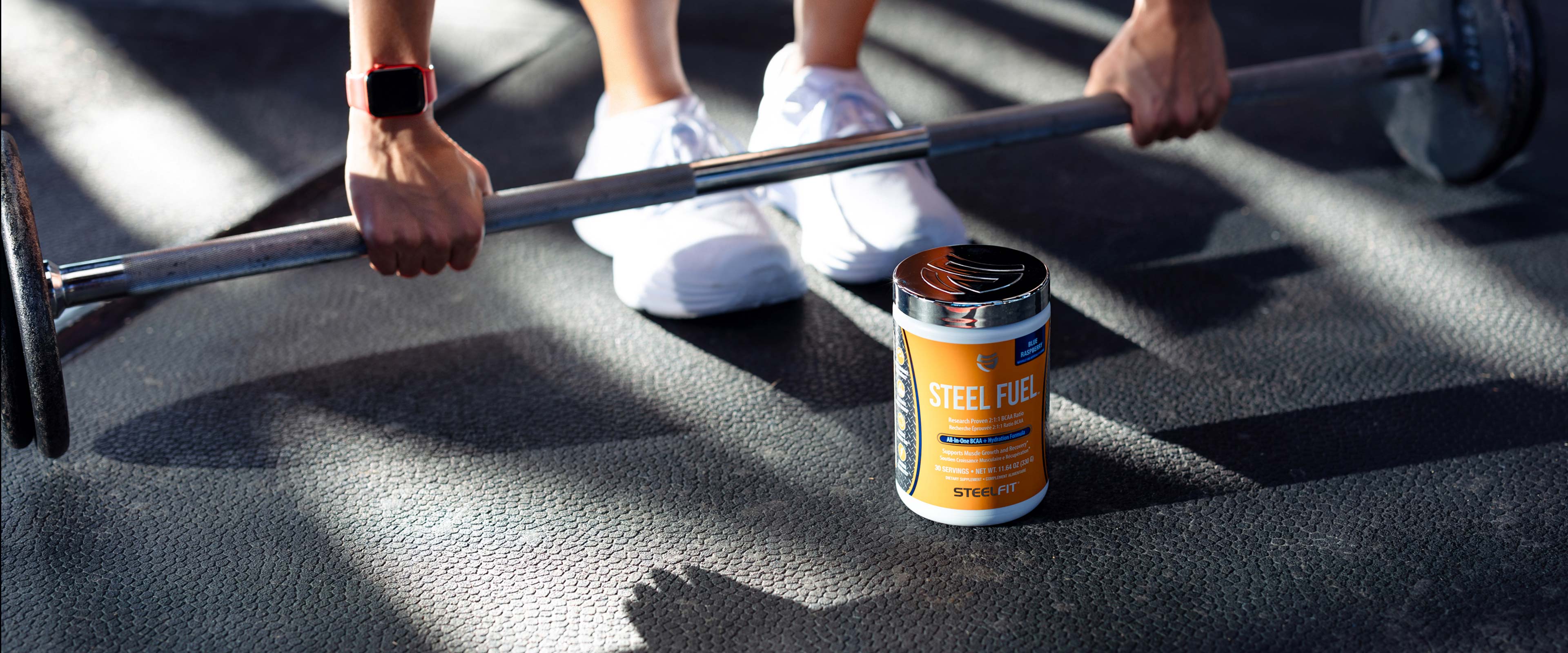 bottle of steel fuel bcaa on gym floor