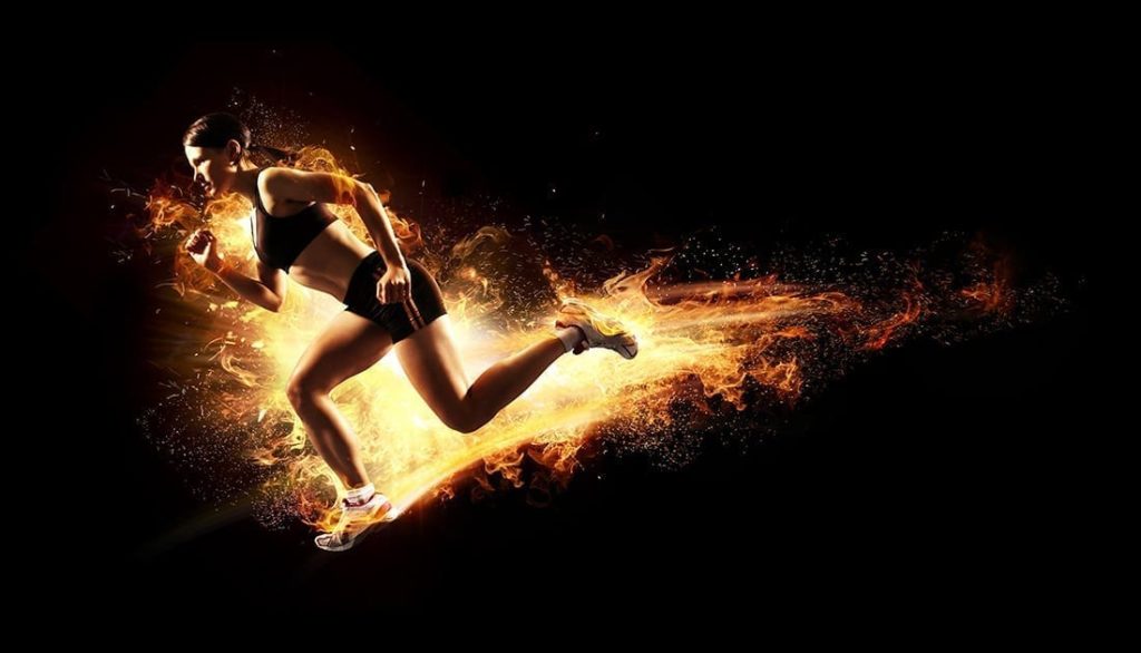 Athletic woman in running pose with added graphics of vibrant flames bursting from her body