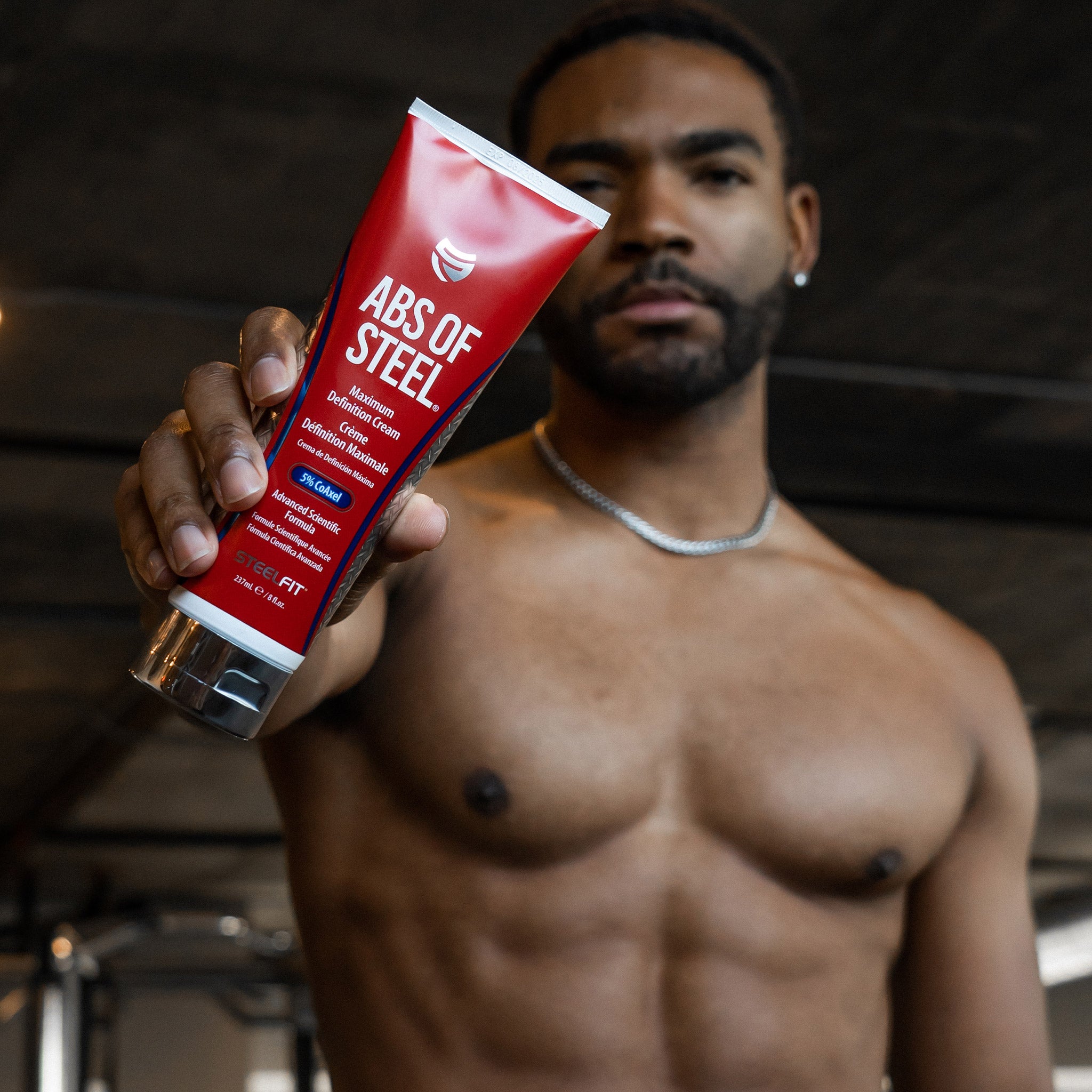 Man holding Abs of Steel cream