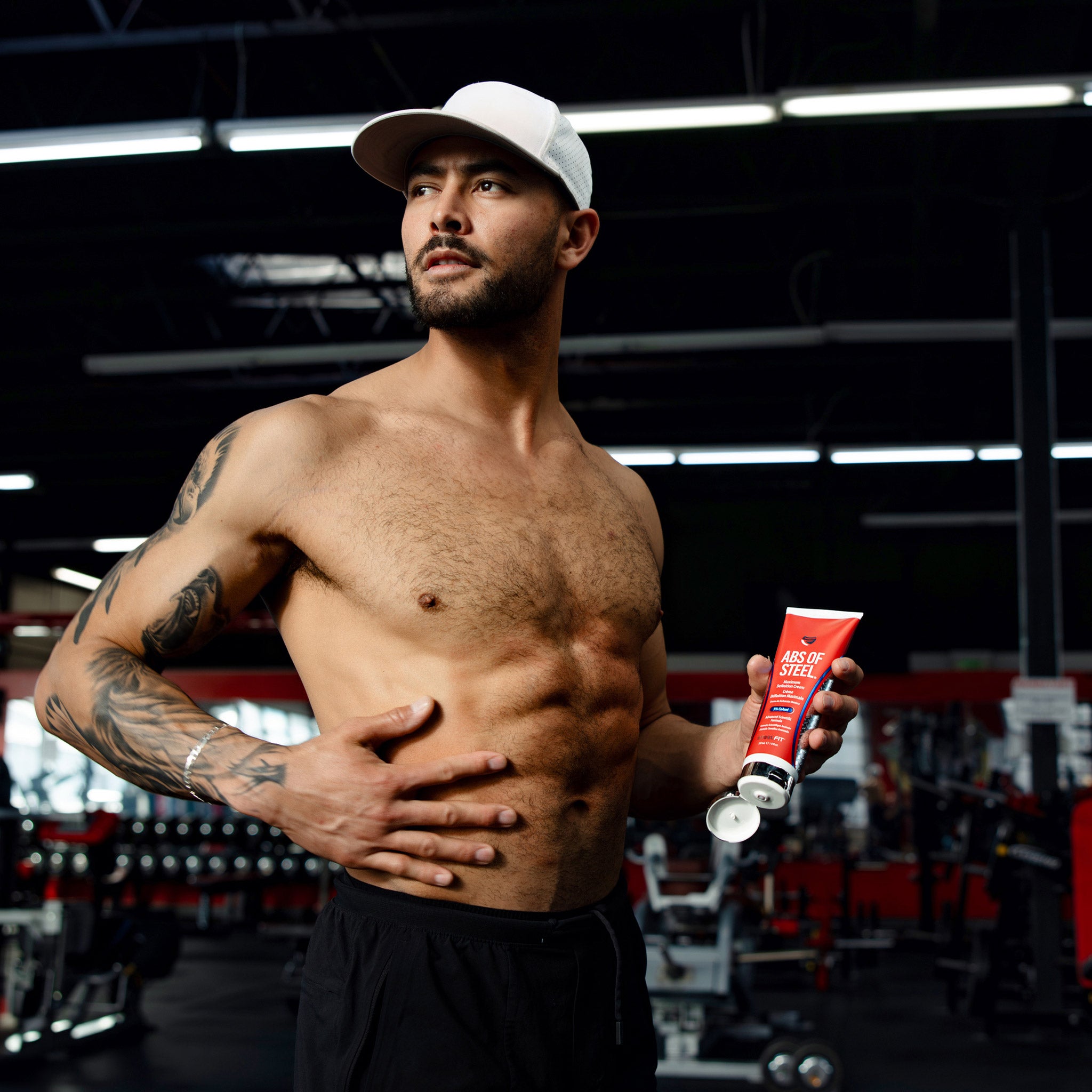 Man holding Abs of Steel Cream