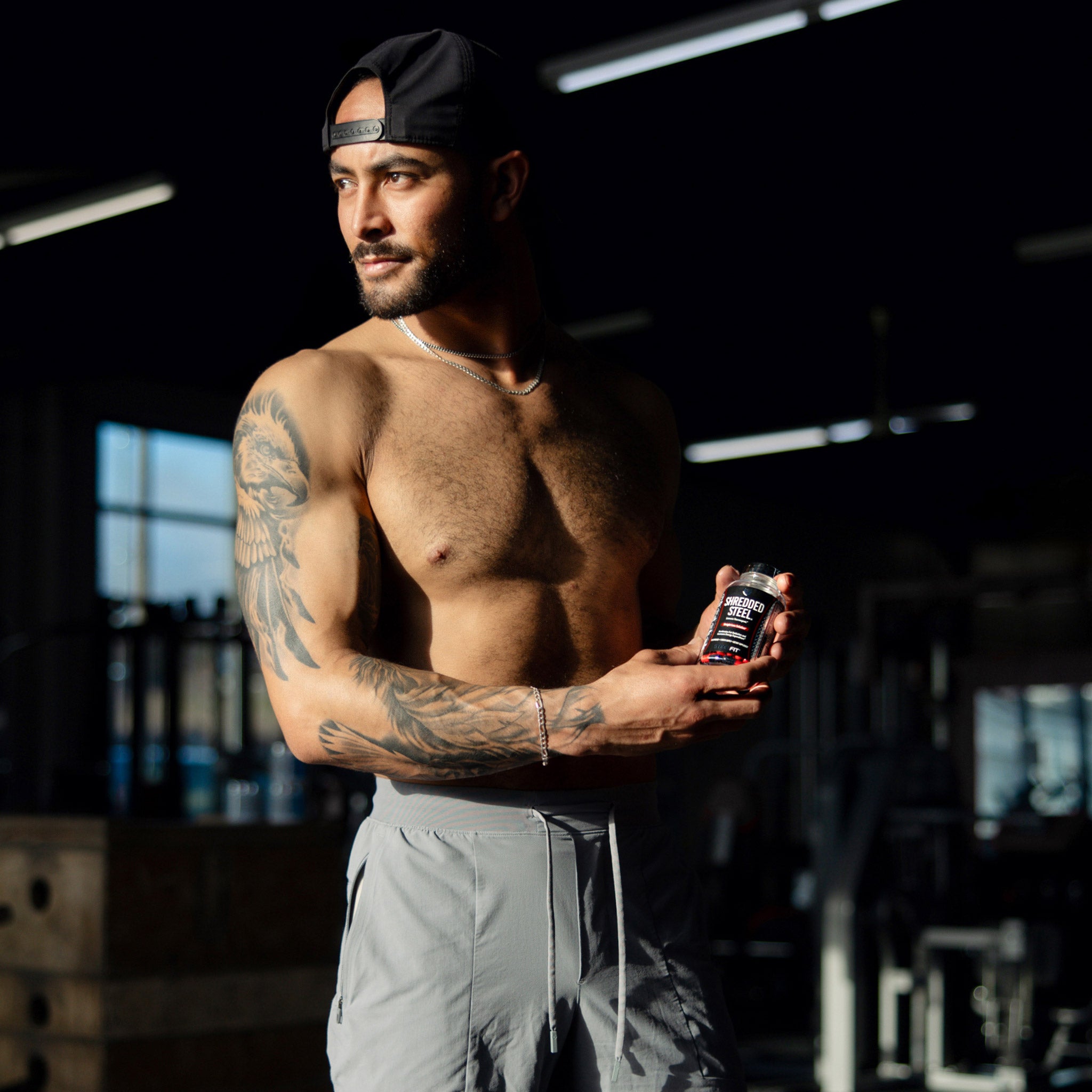 Fit man holding Shredded Steel