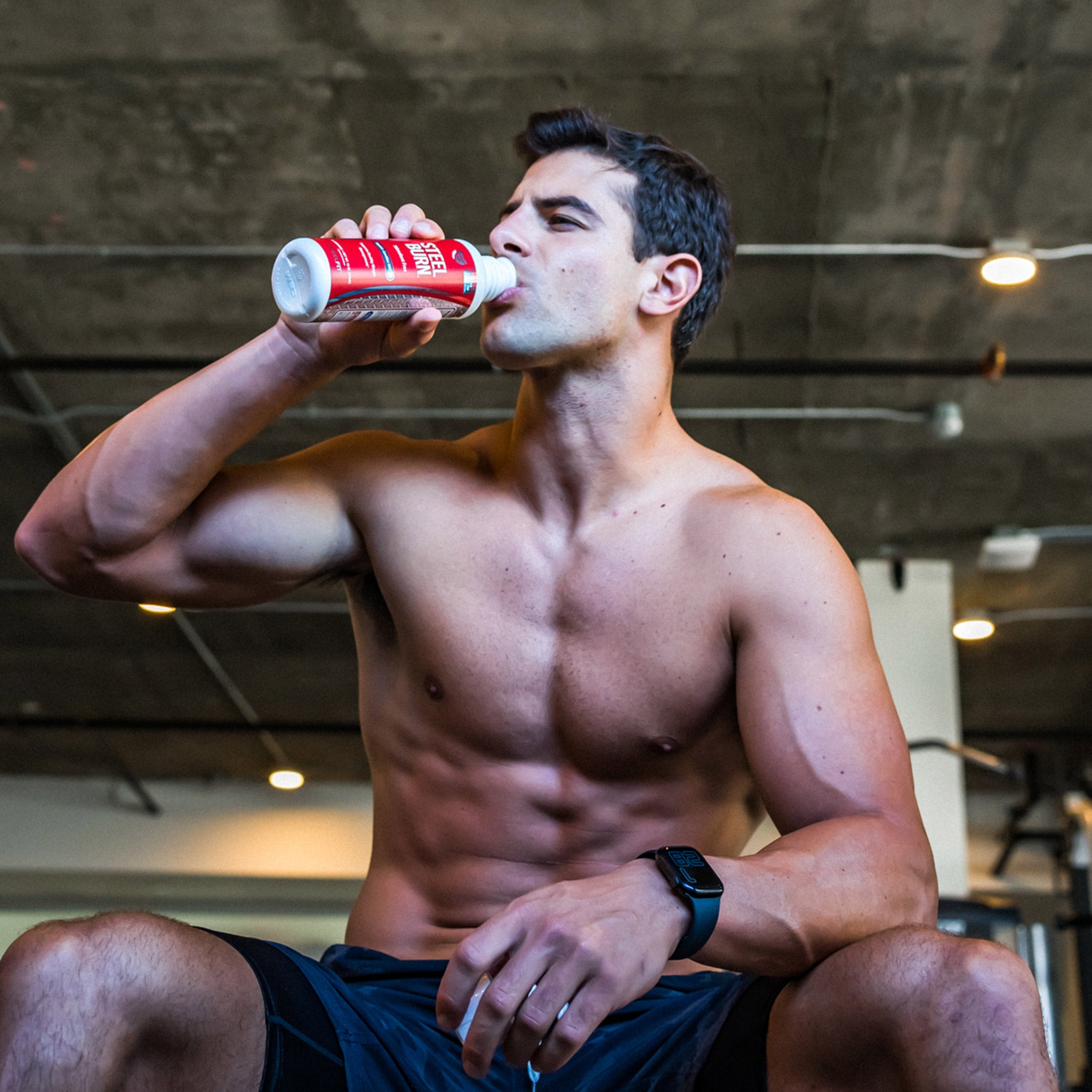 in shape male drinking steel burn