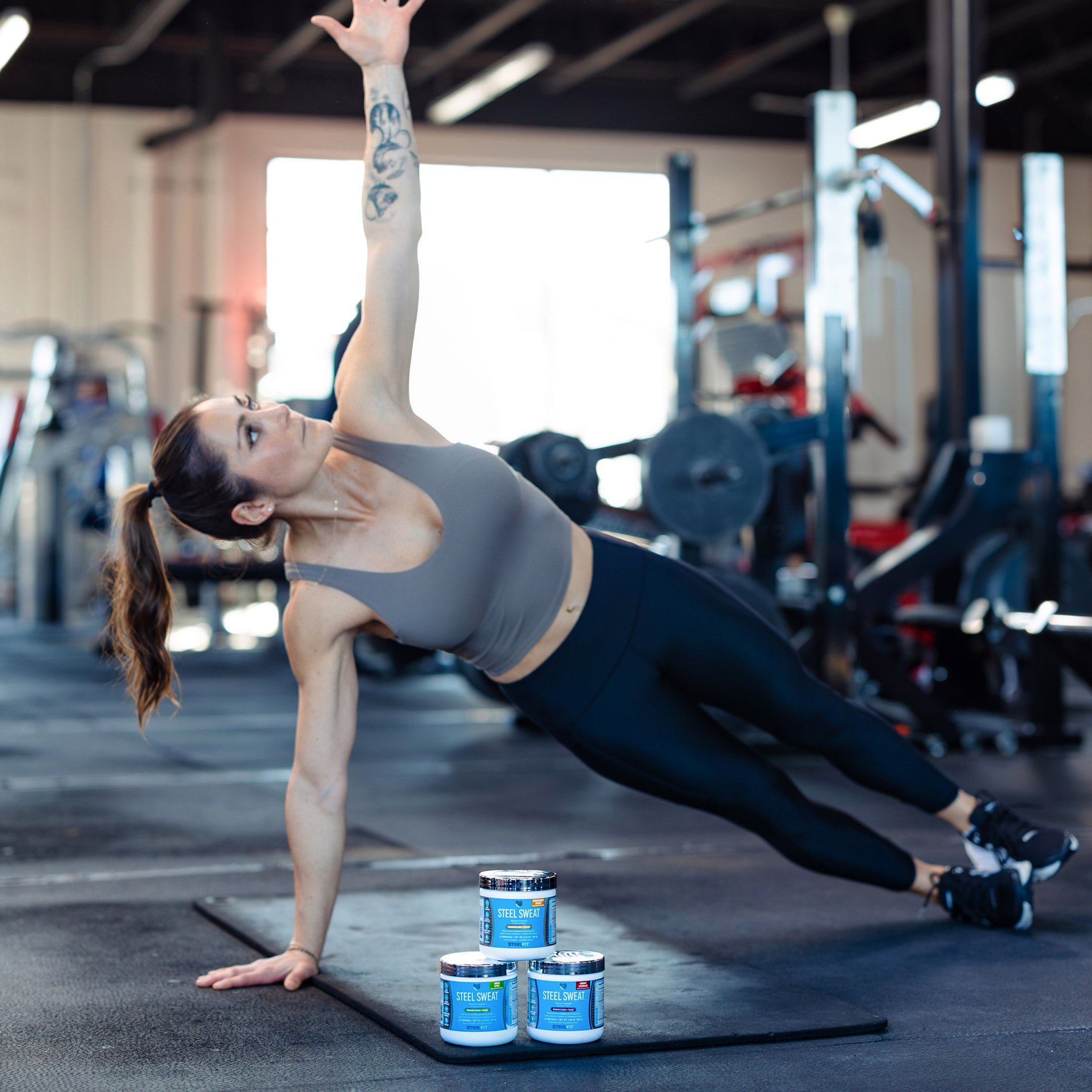 woman working out next to steel sweat