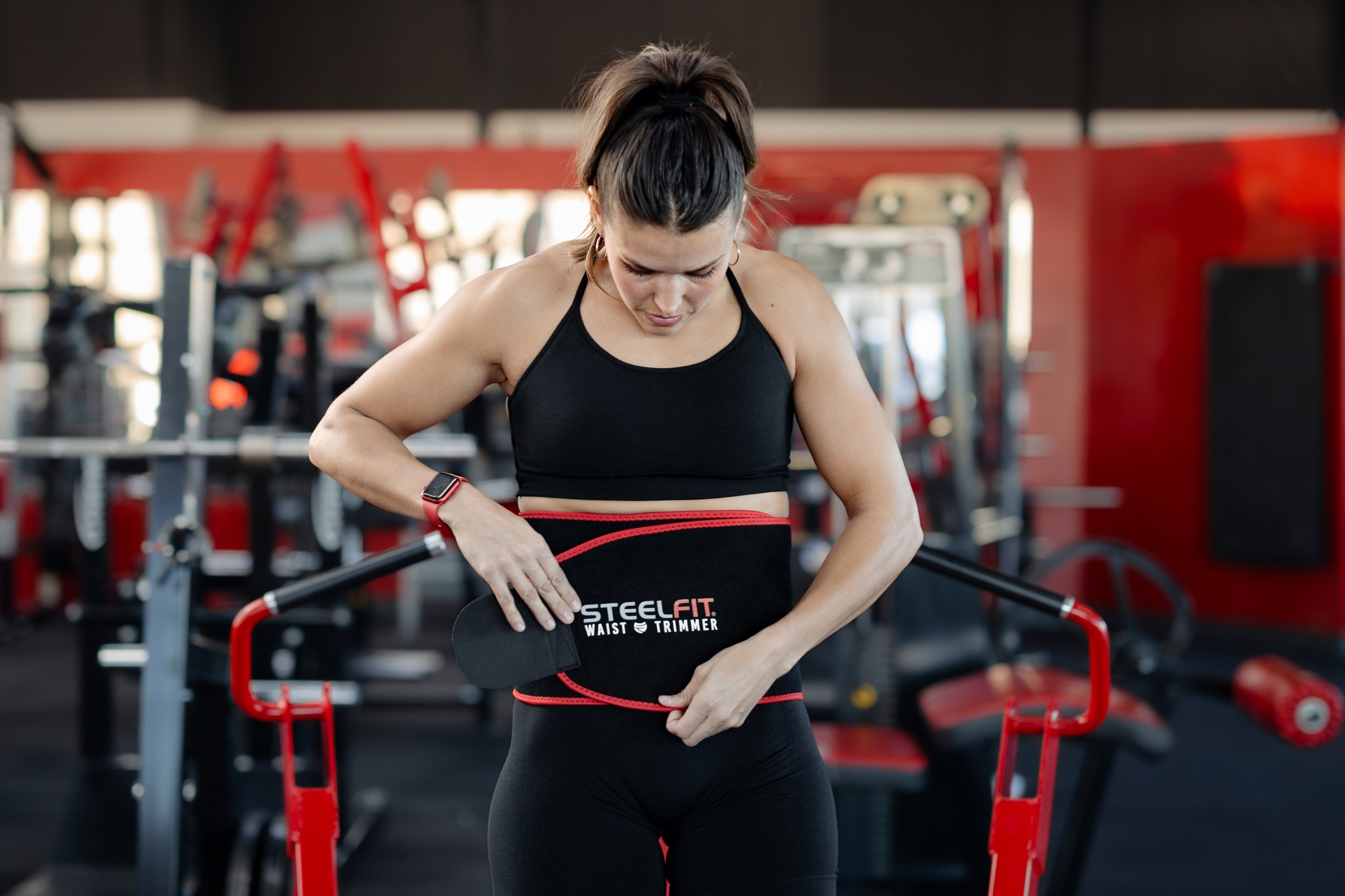 Woman with waist trimmer